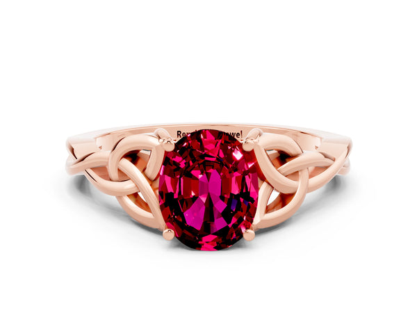 Rose gold Oval Cut Garnet Solitaire Engagement Ring with Celtic Knot Band and Four-Prong Setting