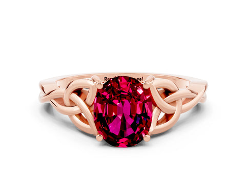 Rose gold Oval Cut Garnet Solitaire Engagement Ring with Celtic Knot Band and Four-Prong Setting