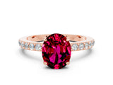 Rose gold Oval Cut Garnet Solitaire Engagement Ring with Pavé Band and Four-Prong Setting