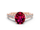 Rose gold Oval Cut Garnet Solitaire Ring with Cathedral Setting and Pavé Band