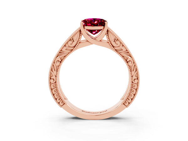 Rose gold Oval Cut Garnet Solitaire Ring with Engraved Band and Four-Prong Setting