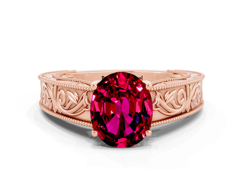 Rose gold Oval Cut Garnet Solitaire Ring with Engraved Band and Four-Prong Setting
