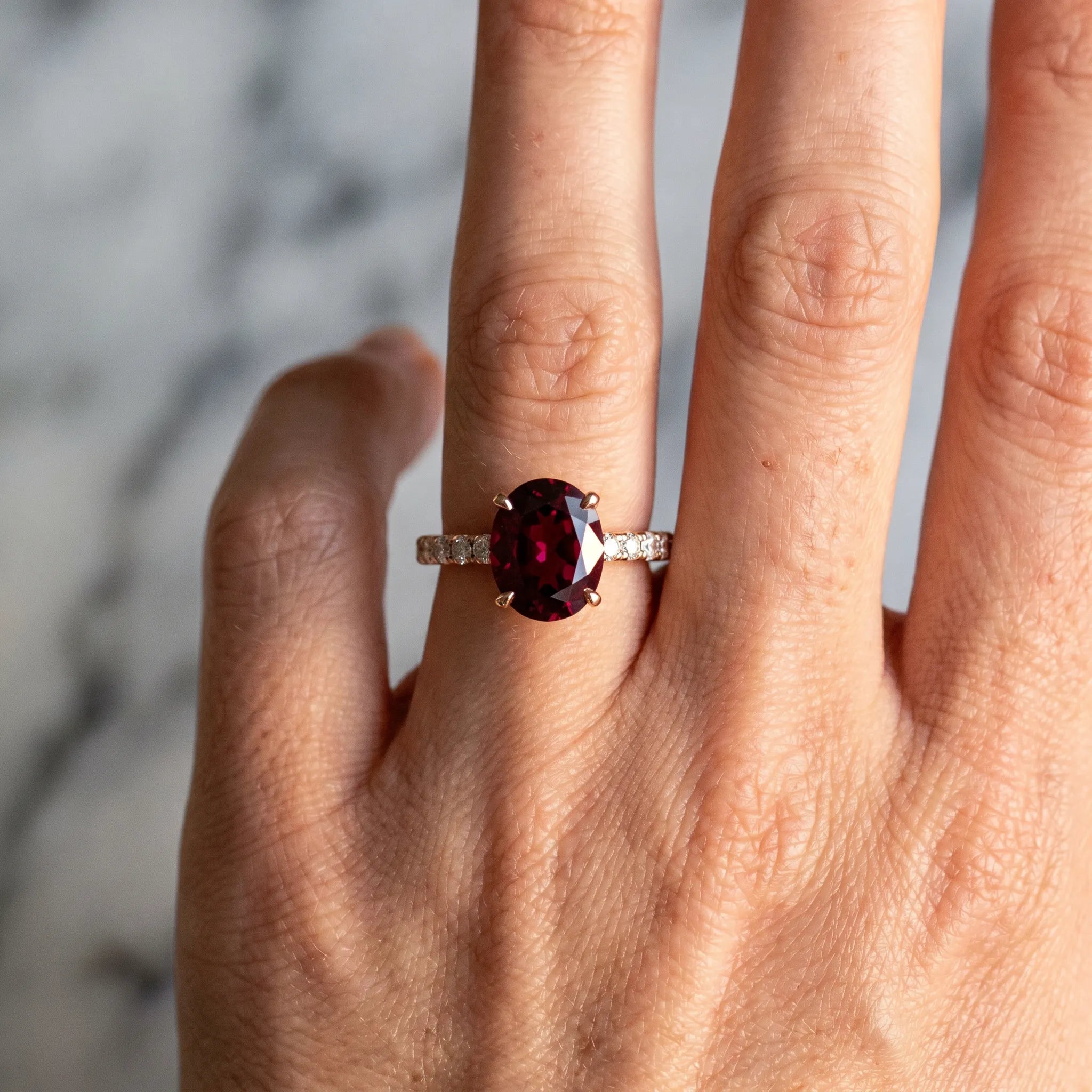 Rose gold Oval Cut Garnet Solitaire Ring with Round  Pavé Band and Four-Prong Setting_42