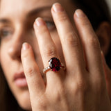Rose gold Oval Cut Garnet Solitaire Ring with Round  Pavé Band and Four-Prong Setting_44