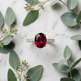 Rose gold Oval Cut Garnet Solitaire Ring with Round  Pavé Band and Four-Prong Setting_45