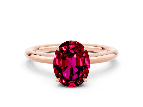 Rose gold Oval Cut Garnet Solitaire Ring with Thin Band and Four-Prong Setting