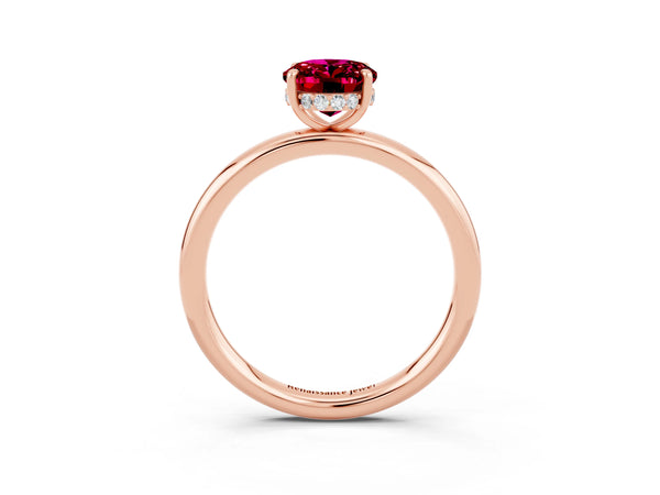 Rose gold Oval Cut Garnet Solitaire Ring with Thin Band and Four-Prong Setting