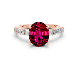 Rose gold Oval Cut Garnet Solitaire with Side Baguettes and Channel Set Band