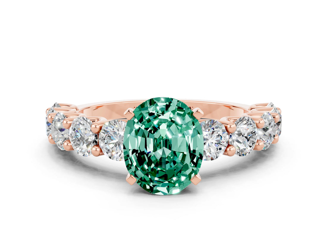 Rose gold Oval Cut Green Sapphire Prong Setting with Side Stones on a Pave Band