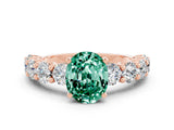 Rose gold Oval Cut Green Sapphire Prong Setting with Side Stones on a Pave Band