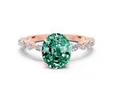 Rose gold Oval Cut Green Sapphire Solitaire with Side Stones on a Pavé Band and Four-Prong Setting