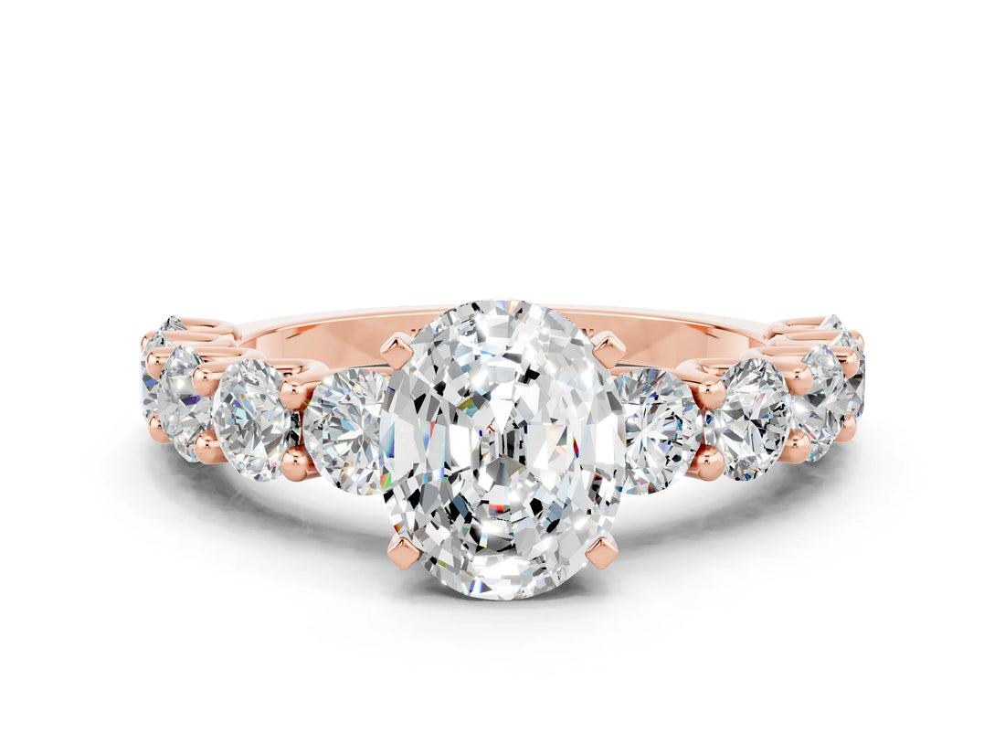 Rose gold Oval Cut Moissanite Prong Setting with Side Stones on a Pave Band