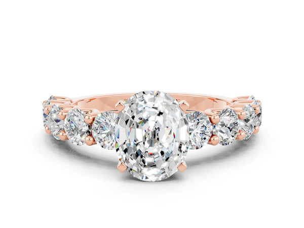 Rose gold Oval Cut Moissanite Prong Setting with Side Stones on a Pave Band