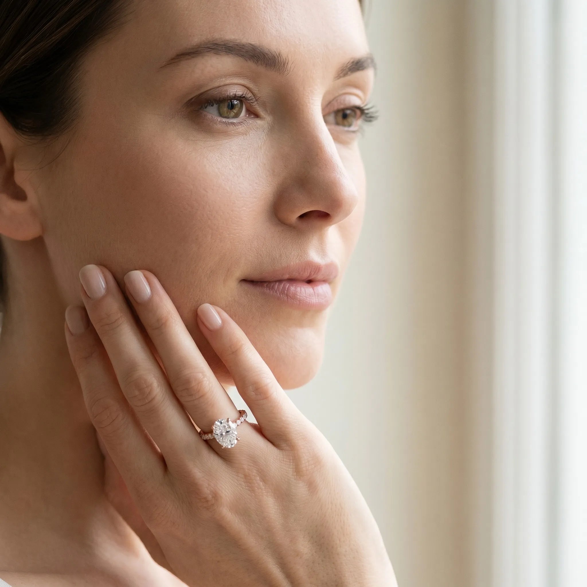 Rose gold Oval Cut Moissanite Solitaire Ring with Round  Pavé Band and Four-Prong Setting