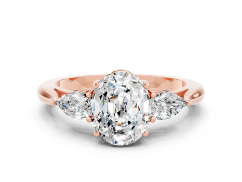 Rose gold Oval Cut Moissanite Three-Stone Ring with Pear Side Stones and Four-Prong Setting_12