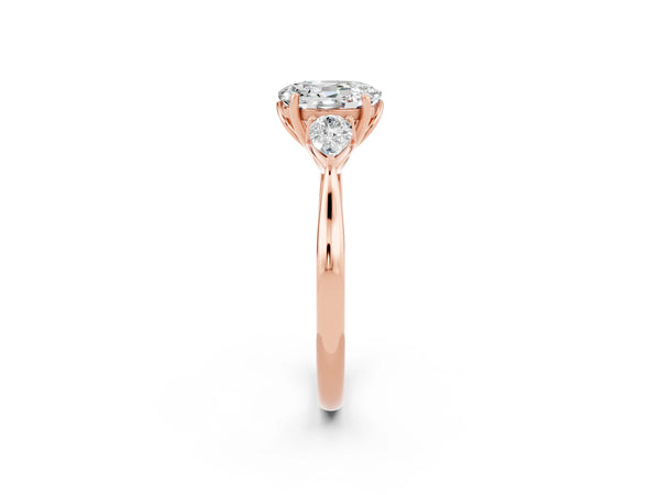 Rose gold Oval Cut Moissanite Three-Stone Ring with Pear  Side Stones and Prong Setting