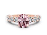 Rose gold Oval Cut Morganite Prong Setting with Side Stones on a Pave Band