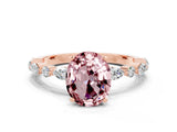 Rose gold Oval Cut Morganite Solitaire with Side Stones on a Pavé Band and Four-Prong Setting