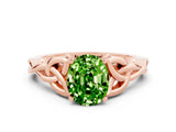 Rose gold Oval Cut Peridot Solitaire Engagement Ring with Celtic Knot Band and Four-Prong Setting