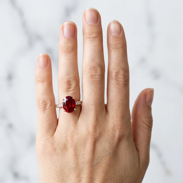 Rose gold Oval Cut Ruby Solitaire Ring with Round  Pavé Band and Four-Prong Setting