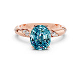 Rose gold Oval Cut Solitaire Diamond Engagement Ring with Twisted Pave Band and Four-Prong Setting
