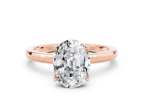 Rose gold Oval Cut Solitaire Diamond Ring with Thin Band and Four-Prong Setting