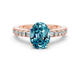 Rose gold Oval Cut Solitaire Diamond with Pavé Band and Four-Prong Setting
