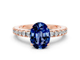 Rose gold Oval Cut Solitaire Diamond with Pavé Band and Four-Prong Setting