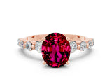 Rose gold Oval Cut Solitaire Garnet Ring with Pave Band and Four-Prong Setting