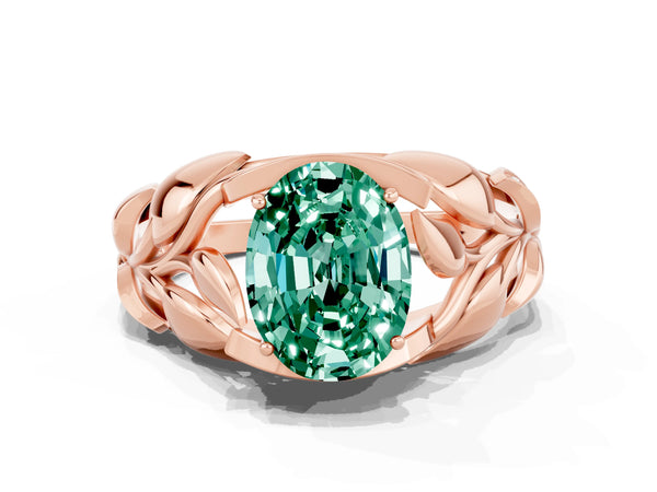 Rose gold Oval Cut Green Sapphire Leaf-Inspired Engagement Ring with Round Accents and Prong Setting