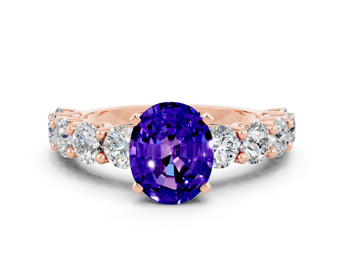 Rose gold Oval Cut Tanzanite Prong Setting with Side Stones on a Pave Band
