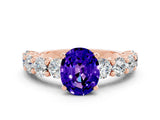 Rose gold Oval Cut Tanzanite Prong Setting with Side Stones on a Pave Band