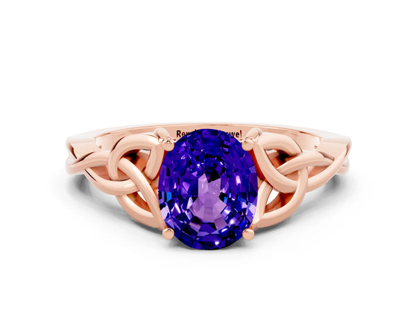 Rose gold Oval Cut Tanzanite Solitaire Engagement Ring with Celtic Knot Band and Four-Prong Setting