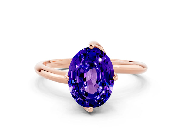 Rose gold Oval Cut Tanzanite Solitaire Engagement Ring with Four-Prong Setting and Classic Band