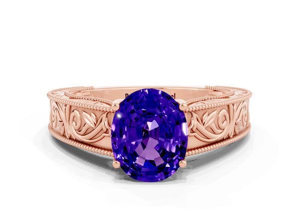 Rose gold Oval Cut Tanzanite Solitaire Ring with Engraved Band and Four-Prong Setting