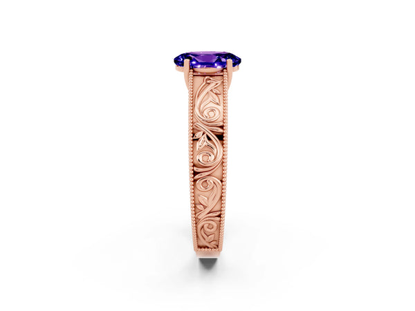 Rose gold Oval Cut Tanzanite Solitaire Ring with Engraved Band and Four-Prong Setting