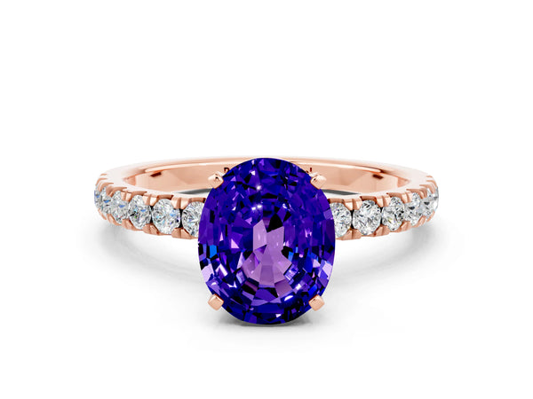 Rose gold Oval Cut Tanzanite Solitaire Ring with Pavé Accents and Four-Prong Setting