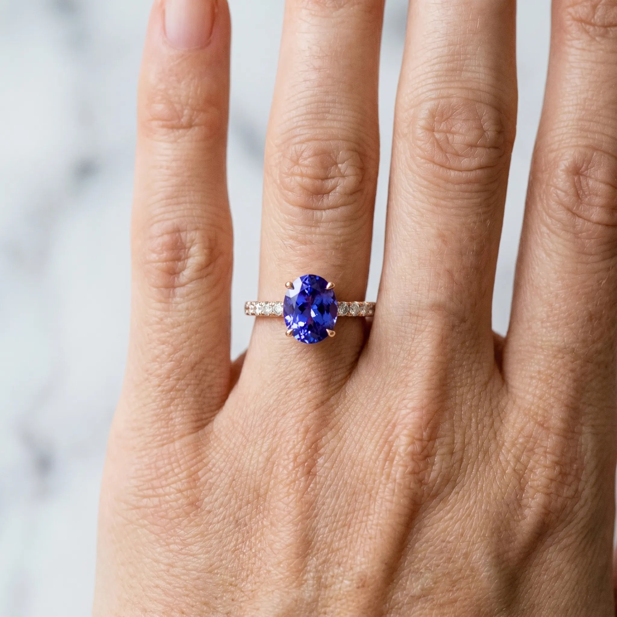 Rose gold Oval Cut Tanzanite Solitaire Ring with Round  Pavé Band and Four-Prong Setting_42