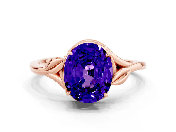 Rose gold Oval Cut Tanzanite Solitaire Ring with Twist Band and Four-Prong Setting