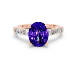 Rose gold Oval Cut Tanzanite Solitaire with Side Baguettes and Channel Set Band