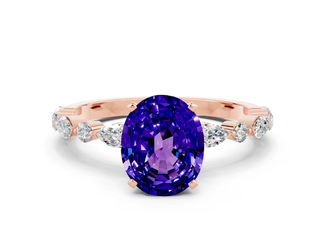 Rose gold Oval Cut Tanzanite Solitaire with Side Stones on a Pavé Band and Four-Prong Setting