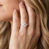 Rose gold Oval Cut Three-Stone Diamond Ring with Pear Side Stones on a Classic Solitaire Band with Prong Setting_8