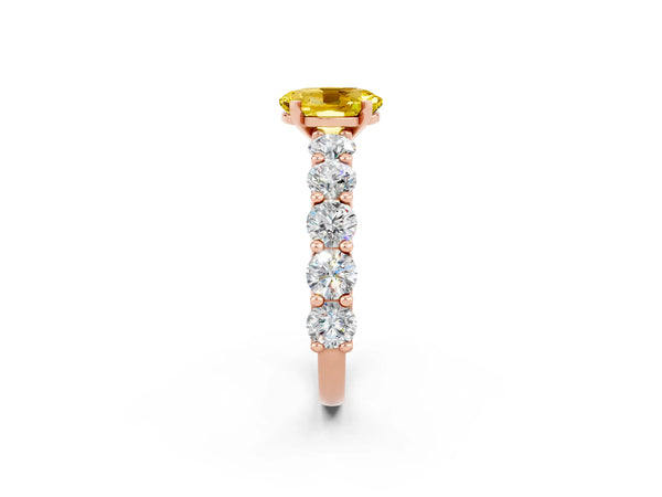 Rose gold Oval Cut Yellow Sapphire Prong Setting with Side Stones on a Pave Band