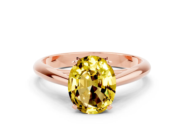 Rose gold Oval Cut Yellow Sapphire Solitaire Engagement Ring with Cathedral Setting and Four-Prong Mount