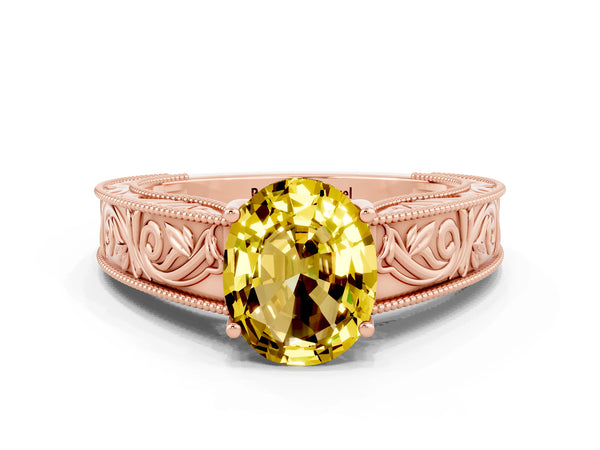 Rose gold Oval Cut Yellow Sapphire Solitaire Ring with Engraved Band and Four-Prong Setting