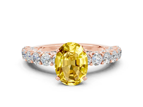 Rose gold Oval Cut Yellow Sapphire Solitaire Ring with Shared Prong Pavé Band and Four-Prong Setting