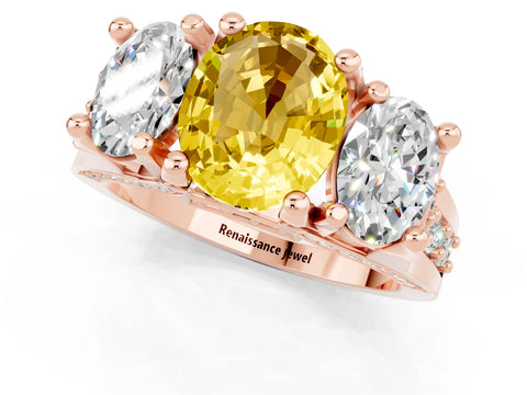 Rose gold Oval Cut Yellow Sapphire Three-Stone Ring with Channel Set Band and Four-Prong Setting_1