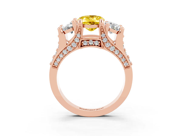 Rose gold Oval Cut Yellow Sapphire Three-Stone Ring with Channel Set Band and Four-Prong Setting