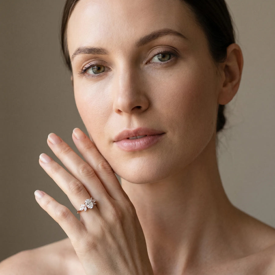 Rose gold Oval Diamond Floral Cluster Ring with Marquise Side Stones and Six-Prong Solitaire Setting