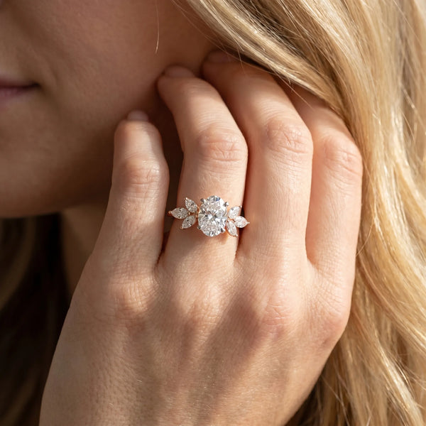 Rose gold Oval Diamond Floral Cluster Ring with Marquise Side Stones and Six-Prong Solitaire Setting